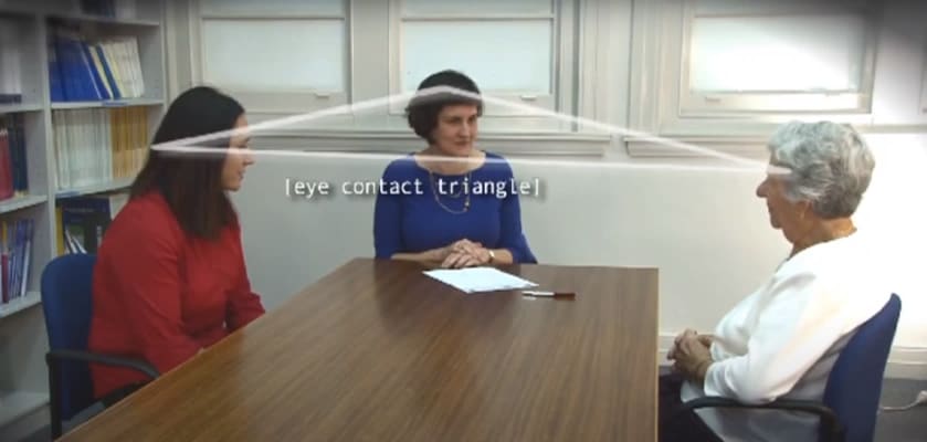 Image of three people sitting at a table